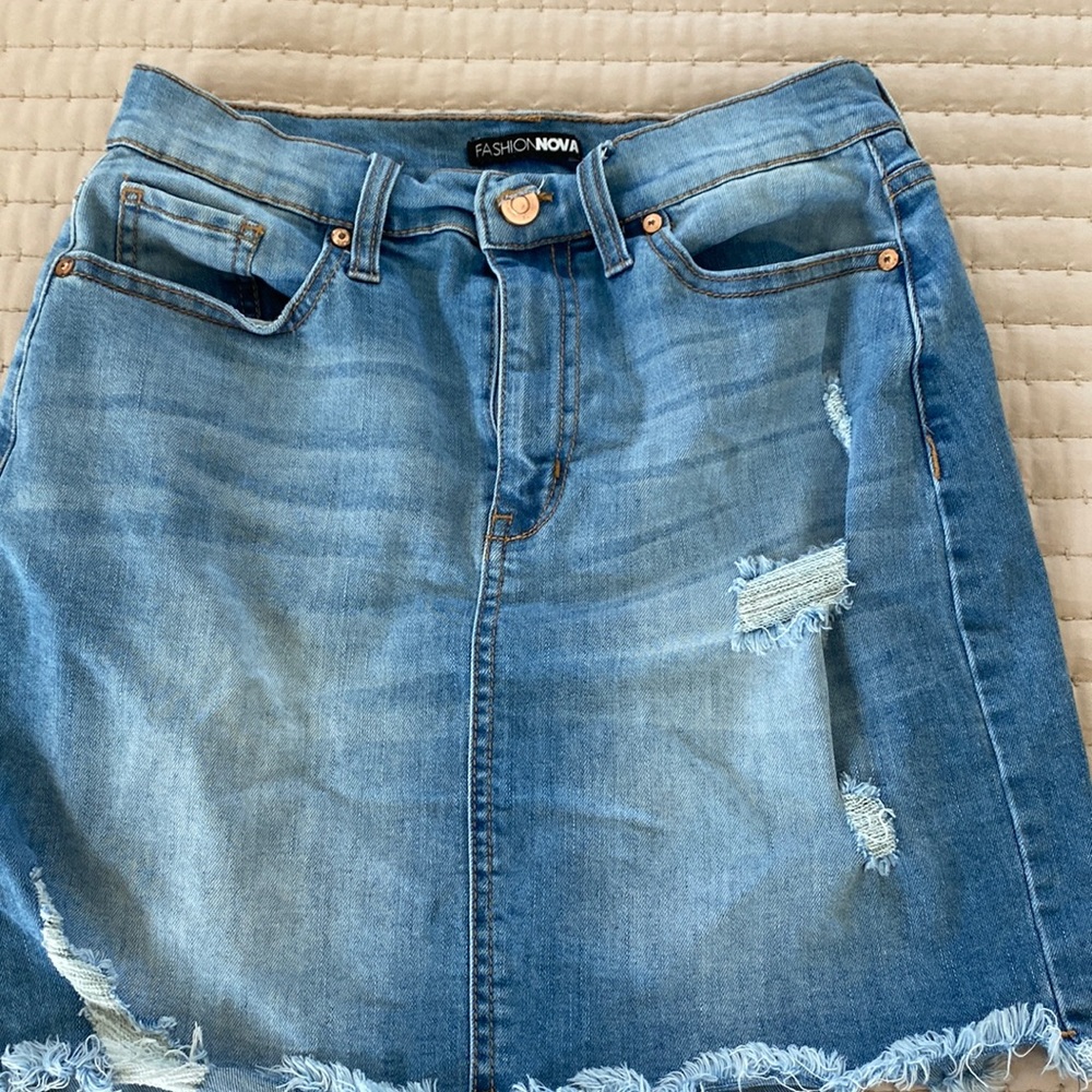 Fashion Nova light wash denim skirt.